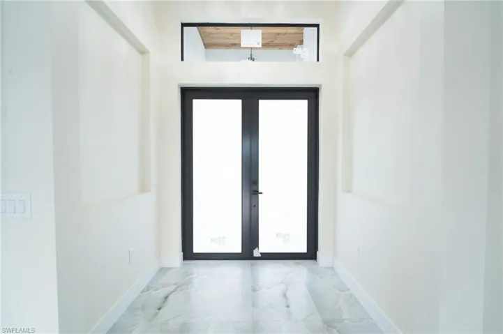 Doorway featuring french doors