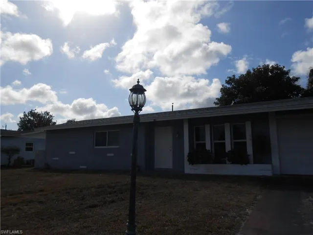 View of front facade featuring an attached garage