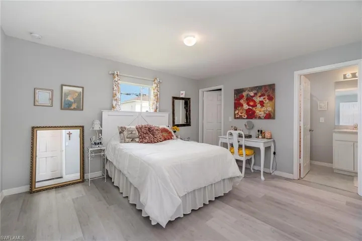 Bedroom featuring ensuite bathroom