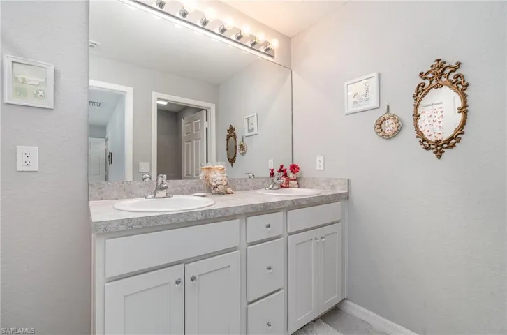 Bathroom with large vanity and dual sinks