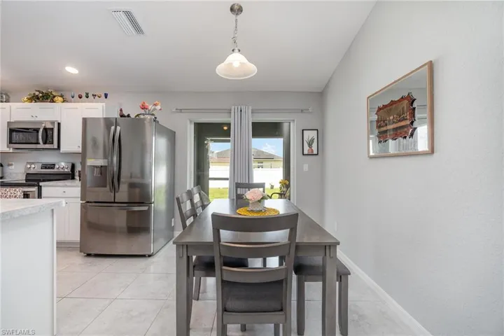 Dining room with light tile floors