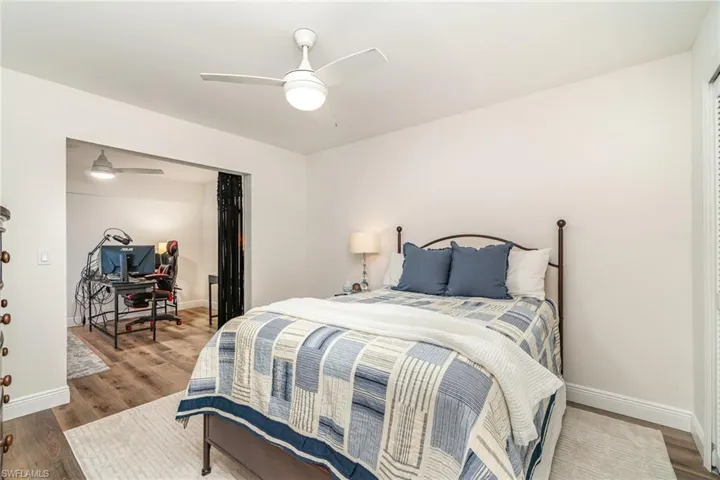 2nd Bedroom featuring baseboards, wood finished floors, and a ceiling fan