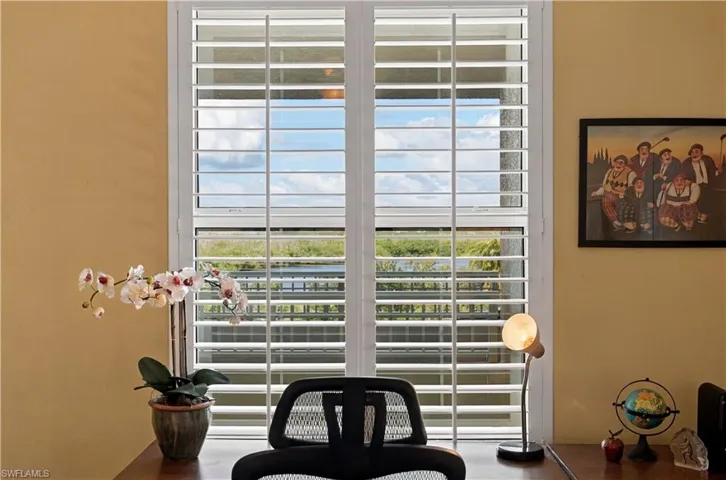 2nd bedroom is currently being used as an office/den. Plantation shutters with views of the front bay!