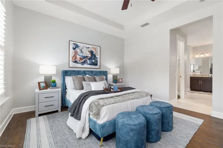 Primary bedroom showing hallway with 2 walk-in closets, leading to ensuite bath