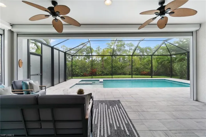 Outdoor living space offers plenty of covered space to enjoy time by the pool