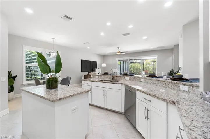Kitchen featuring sink, appliances with stainless steel finishes, a wealth of natural light, and ceiling fan