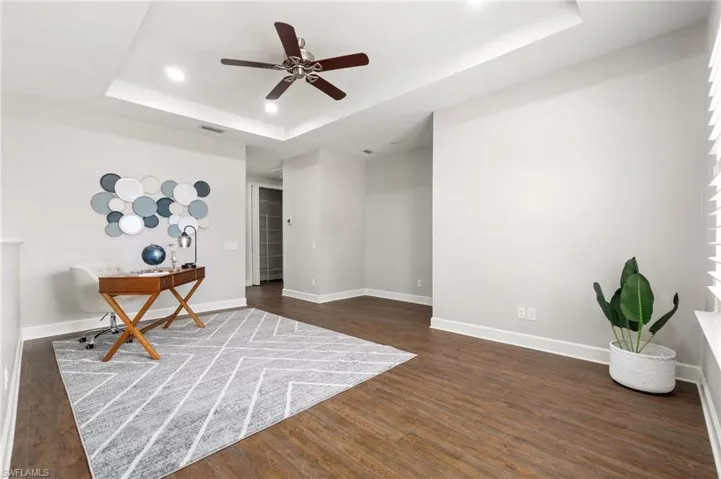 Enormous open upstairs bonus loft featuring recessed accent ceiling tray and recessed wall area perfect for an entertaining TV system as a secondary relaxation room giving the room additional width and height.
