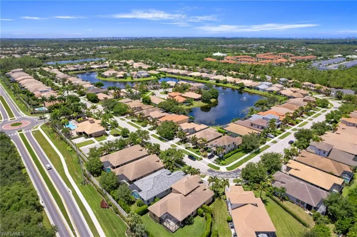 Aerial view of community featuring a water view