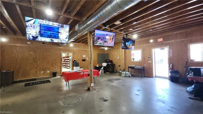 Garage featuring wooden walls