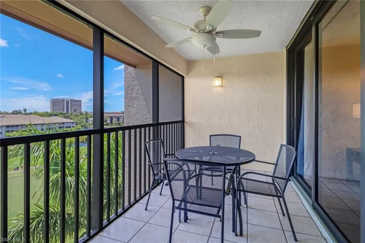 Sunroom / solarium featuring ceiling fan