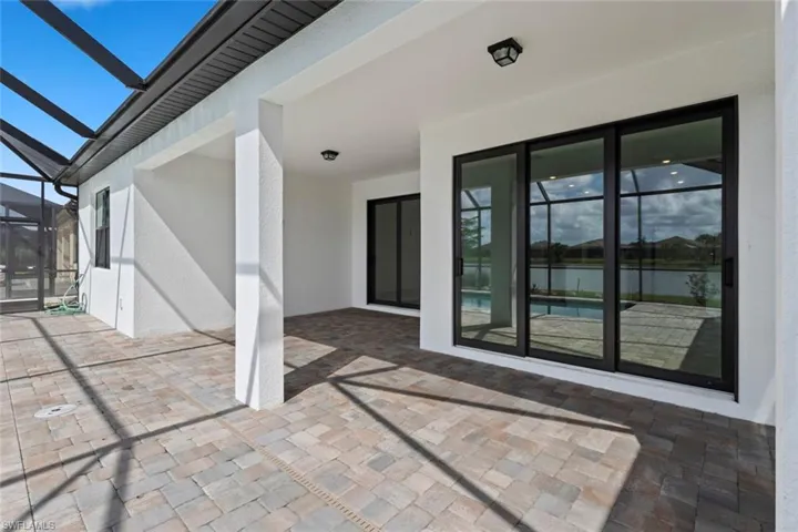View of patio / terrace featuring a sunroom and a lanai