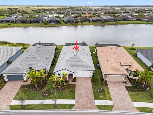 Aerial view of residential area with a large body of water