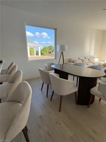 Open-concept living space featuring light wood-finish flooring