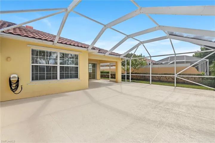 View of patio / terrace featuring a lanai