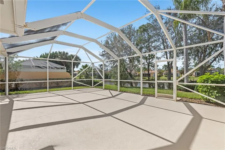 View of patio featuring a lanai