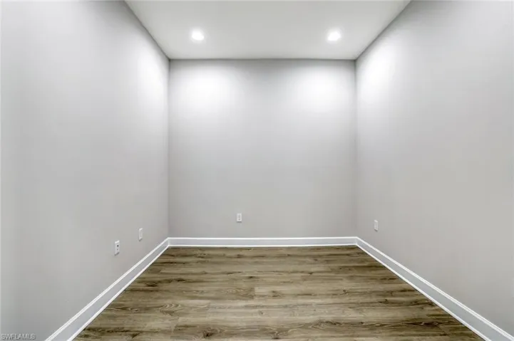 Unfurnished room with light wood-style floors and recessed lighting