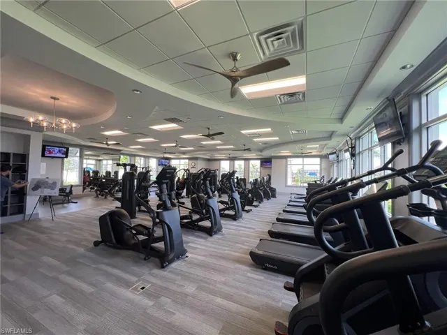 Gym with plenty of natural light and carpet floors