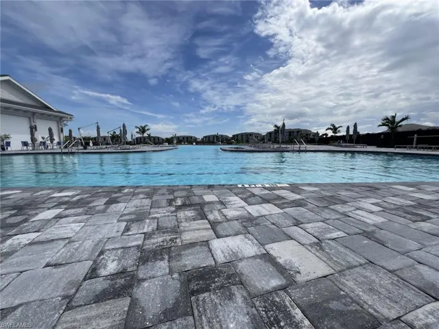 Community pool with a patio area