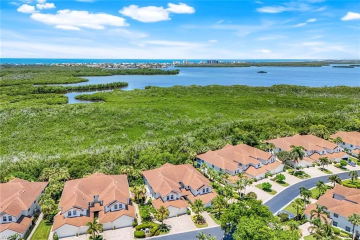 Gorgeous preserve views and peaceful privacy from your corner residence in Bay Pointe at Bonita Bay.