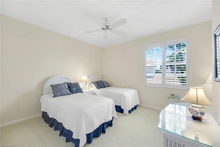 Guest bedroom with twin beds and plenty of closet space.