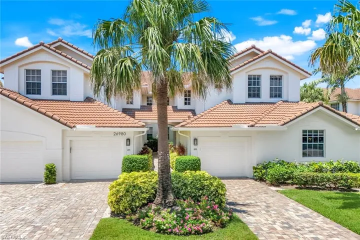 Front entrance surrounded by tropical greenery, welcoming you home.