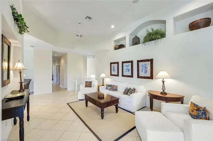 A warm and welcoming great room with lush preserve views.