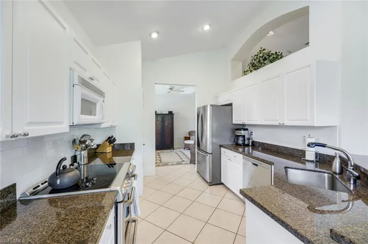 Large kitchen with easy flow into both dining areas.