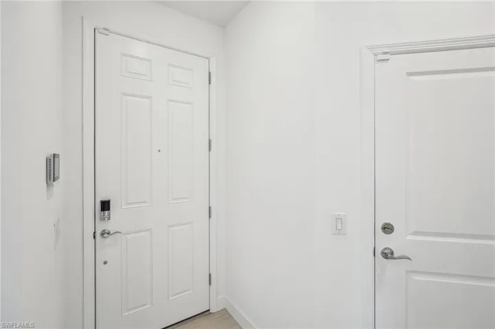 Entryway featuring light tile patterned flooring