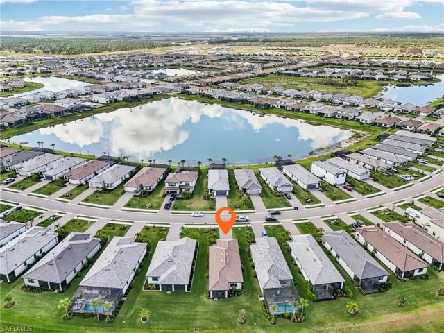 Birds eye view of property featuring a water view