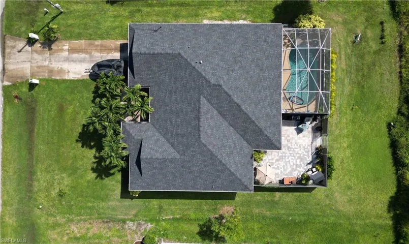 Aerial view of property and surrounding area with a pool