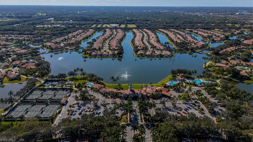 Aerial view of property's location with a large body of water