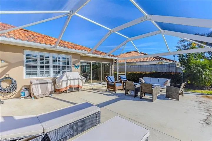 View of patio featuring outdoor lounge area, a sunroom, a lanai, and grilling area