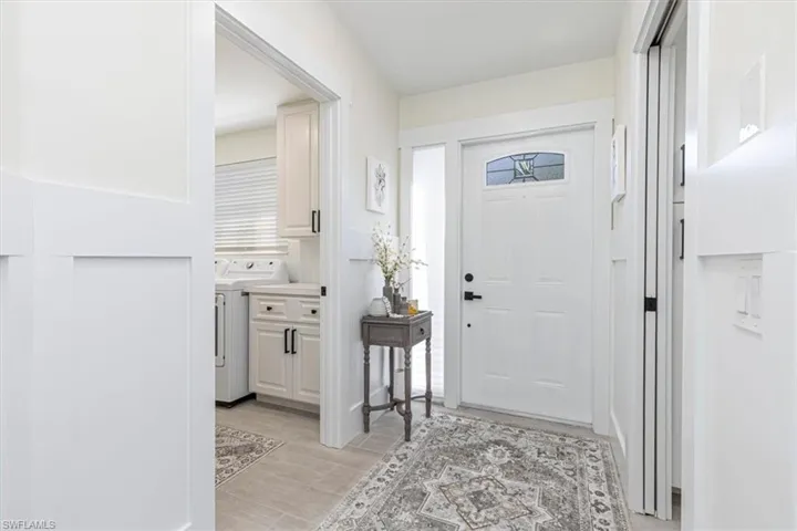 Entrance foyer with wood tiled floors