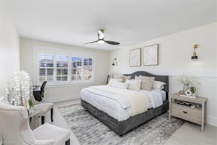Bedroom featuring wood finished floors and ceiling fan