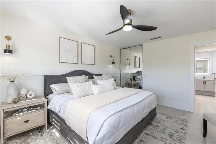 Bedroom with a ceiling fan and a closet