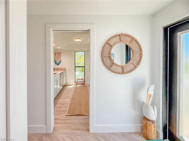 Hall featuring light wood-type flooring