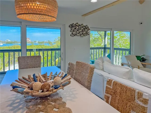Dining area featuring vaulted ceiling