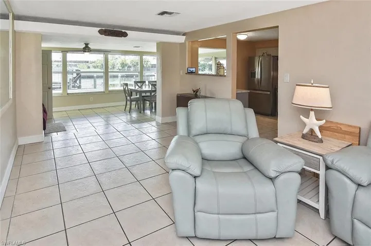 Upon entering, the canal is in view, featuring the canopied boat dock.