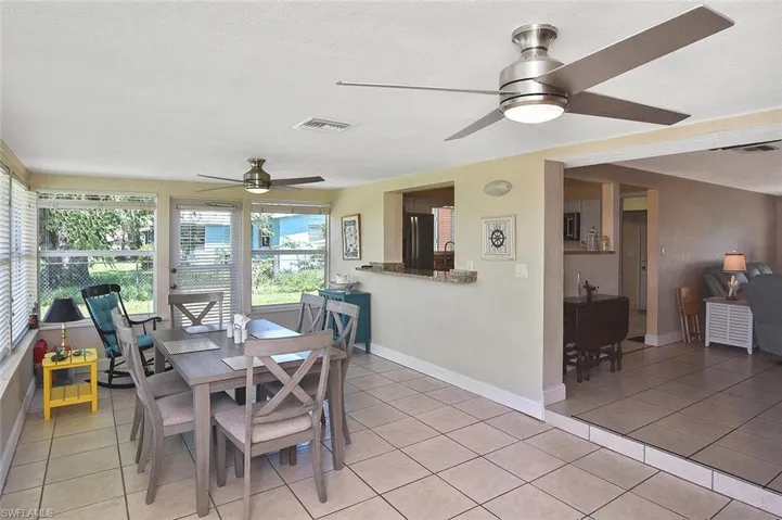 The sunny Florida room is a great gathering spot