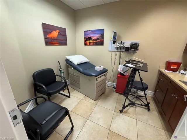 Office area with light tile patterned flooring