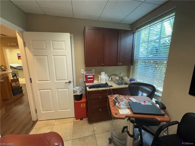 Tiled office with sink