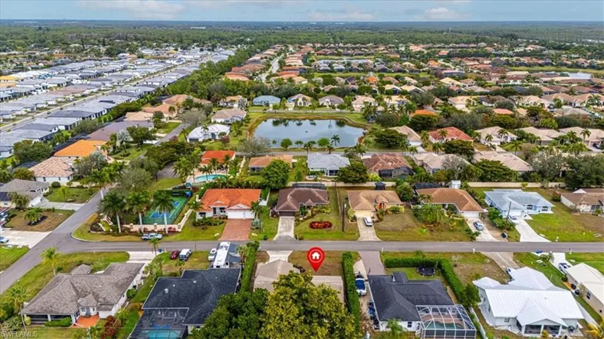 Aerial overview of property's location featuring nearby suburban area