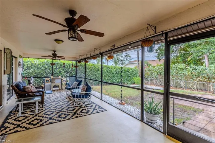 Sunroom / solarium with ceiling fan and outdoor lounge area