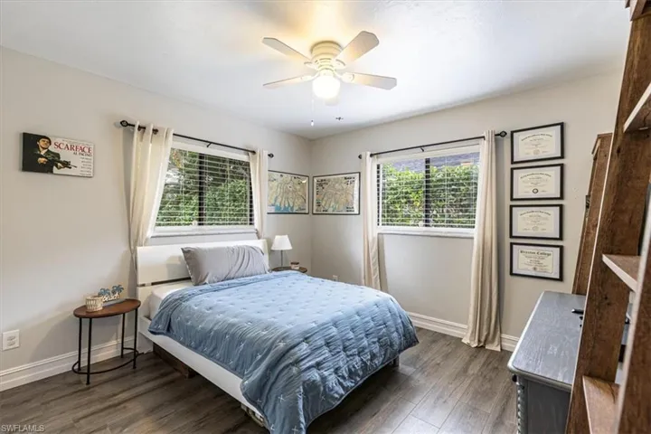 Bedroom with wood finished floors and ceiling fan