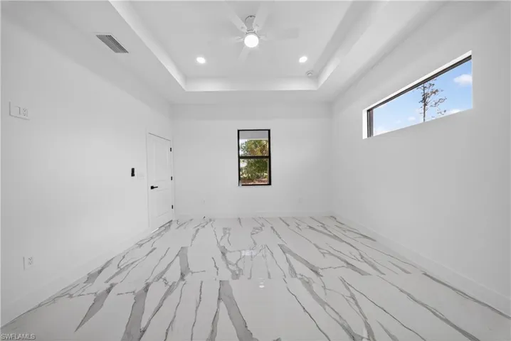 Empty room featuring recessed lighting and ceiling fan