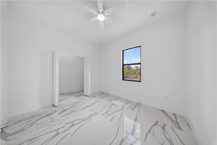 View of patio with ceiling fan