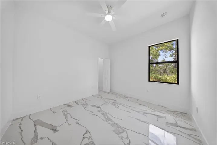 Bathroom view of a marble finish shower