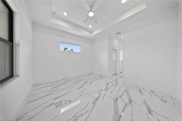 Unfurnished dining area featuring baseboards