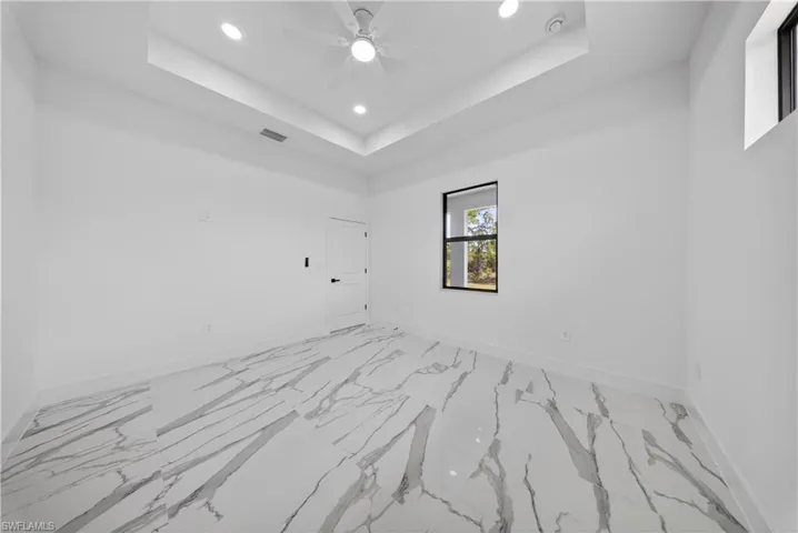 Unfurnished room with ceiling fan and recessed lighting