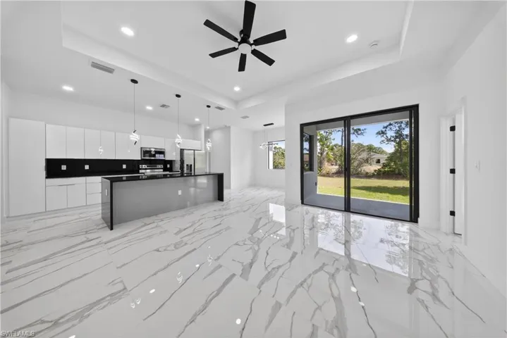 Property entrance with french doors and stucco siding